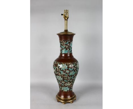 A LARGE CHINESE CHAMPLEVE ENAMEL VASE on a gilt base converted to a lamp. 34ins high.