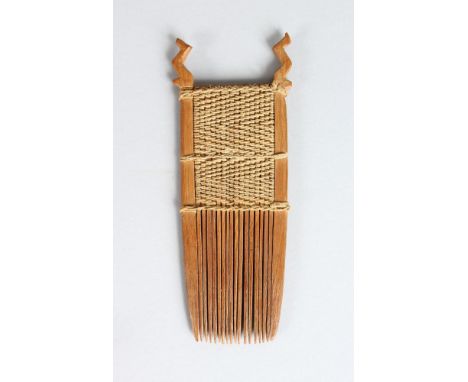 AN EARLY 19TH CENTURY MAORI WOODEN SMALL COMB (HERU MAPARA), NEW ZEALAND  Made of separate wooden teeth lashed together with 