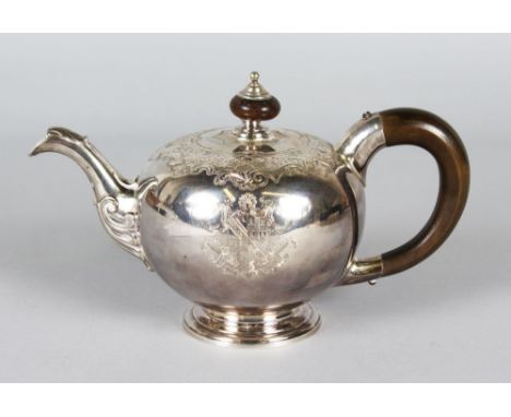 A SUPERB GEORGE II BULLET SHAPED TEAPOT, LONDON 1734, by LEWIS PANTIN, with engraved body, wooden finial and handle and cast 