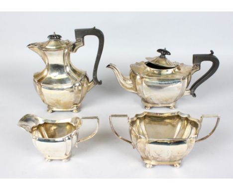 A FOUR PIECE TEA SET, comprising teapot, hot water jug, sugar basin and milk jug, all on bun feet. Birmingham 1946.  Weight 4