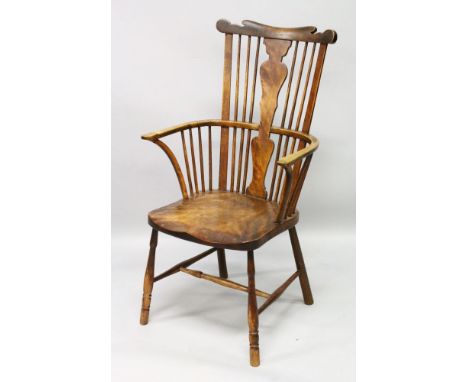 AN 18TH CENTURY COMB BACK WINDSOR ARMCHAIR.
