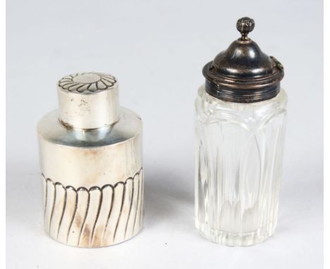 A WRYTHEN FLUTED CIRCULAR TEA CADDY, Birmingham 1902, and A SILVER TOP BOTTLE, London 1857 (2).