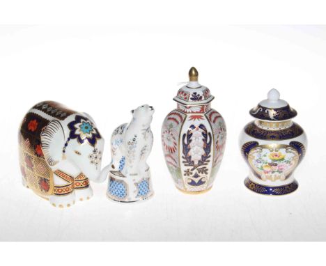 Royal Crown Derby elephant paperweight, Royal Worcester Polar Bear candle-snuffer, and two small ornate Spode vases (4).