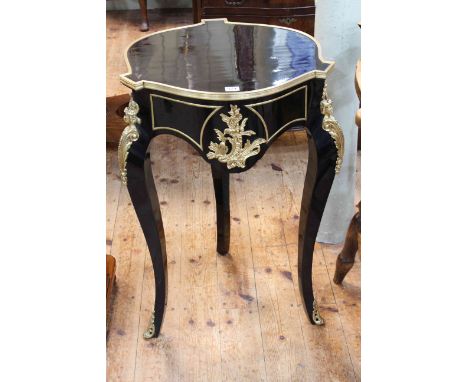 Black lacquered and gilt mounted circular shaped top lamp table, 77cm.