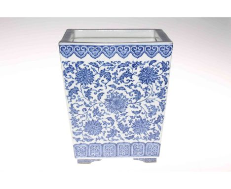 Chinese blue and white square planter of tapering form decorated with floral design, 25cm high.