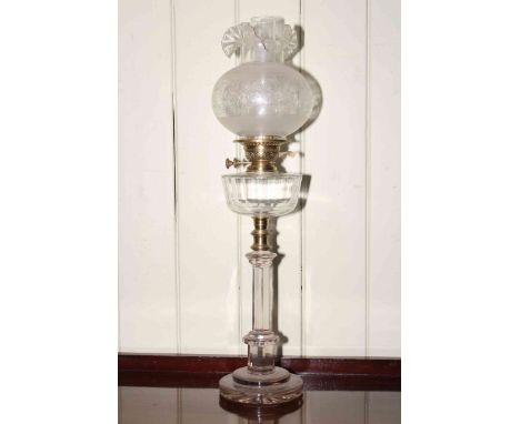 Duplex glass column oil lamp with brass fitting, clear glass reservoir and etched shade.