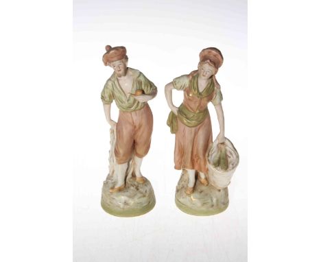 Pair Royal Dux figures of man with pipe and woman with fish basket, pink triangle mark, 22cm.