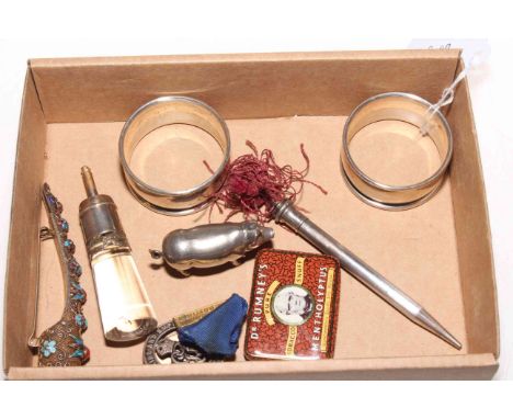 Box with Chinese silver finger brooch, two silver napkin rings, pig vesta, silver pencil, etc.