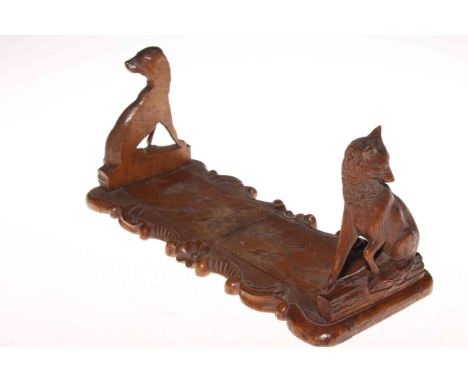 Black Forest expanding book trough carved with fox and hound.