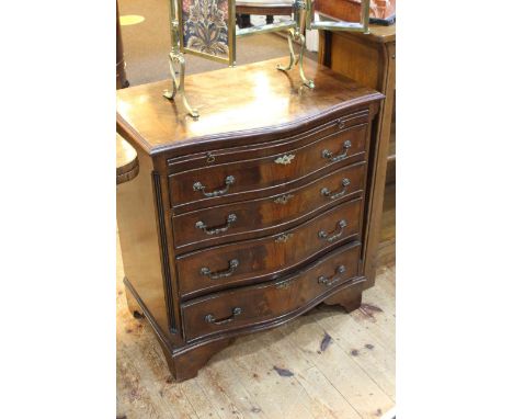 Mahogany serpentine front chest having brush slide above four long drawers on bracket feet, 78cm by 71cm by 47cm.
