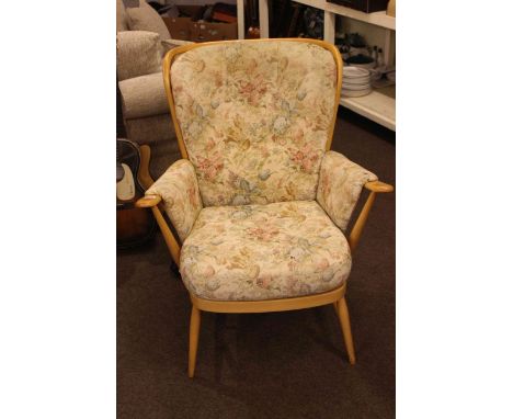 Ercol armchair in buttoned tapestry fabric.