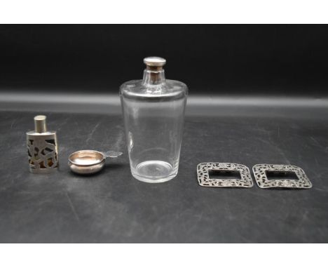 A silver topped dressing table bottle, a Continental silver scent bottle and wine taster along with a pair of white metal sho