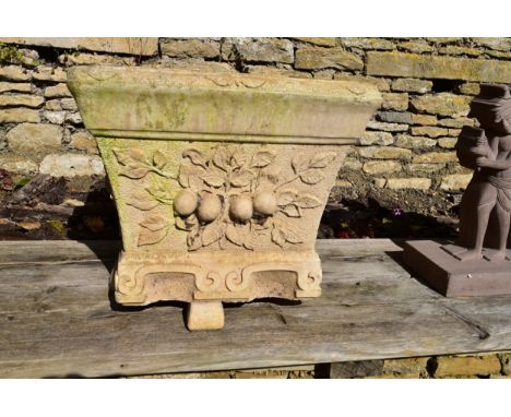 A Willowstone reconstituted stone garden planter with fruit and leaf relief decoration. 