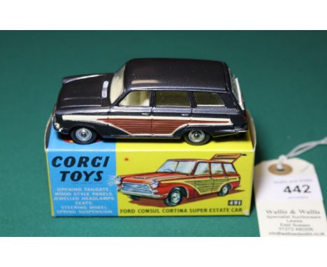 Corgi Toys Ford Consul Cortina Super Estate Car (491). An example in metallic dark grey with wood effect to sides and cream i