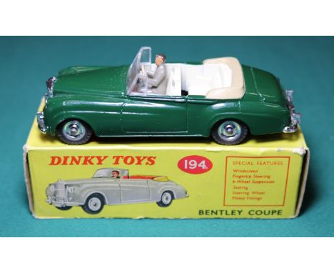 Dinky Toys Bentley Coupe (194). A rare, possibly unique example in dark green with cream interior with tan tonneau cover, bro