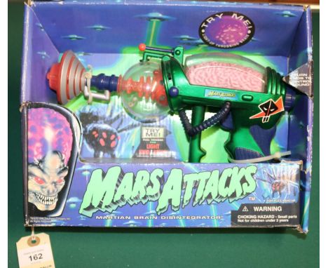 Mars Attacks "Martian Brain Disntigrator". Boxed with some wear in places, Contents look unused. Dates from 1996.  Hard item 