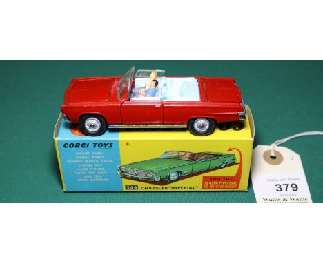 Corgi Toys Chrysler Imperial (418). In deep red with pale blue interior and detailed cast wheels. Complete with both figures 