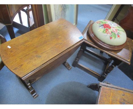 A small oak fall flap table together with an oak stool and a tapestry topped foot stool 