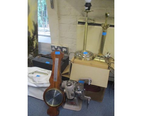 A mixed lot to include a barometer, a projector, a sewing machine, records and table lamps 