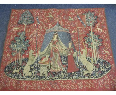 A late 20th century tapestry rug depicting a lady and her maid,  flanked by a lion and a unicorn 