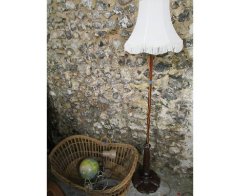 A mixed lot to include an early 20th century mahogany standard lamp with flower head carved base and fabric shade and wicker 