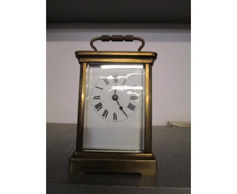 A French brass cased five window carriage clock, with key 