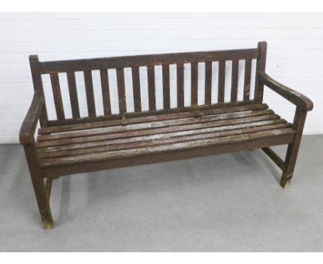 Weathered wooden garden bench with slatted back and seat, 153 x 84 x 56cm.