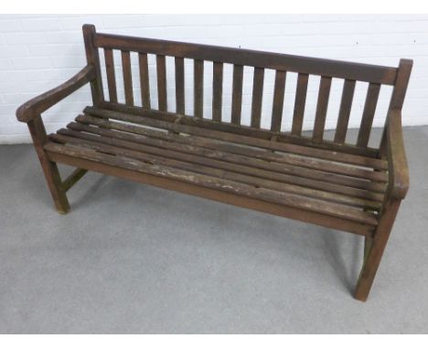 Weathered wooden garden bench with slatted back and seat 153 x 84 x 56cm.