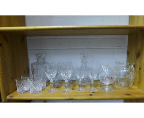 A collection of crystal drinking glasses, water jug and spirit decanter and stopper etc (a lot) 