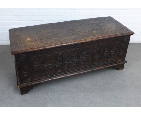 Carved oak coffer /  trunk, hinged lid and void interior, 121 x 51 x 43cm.