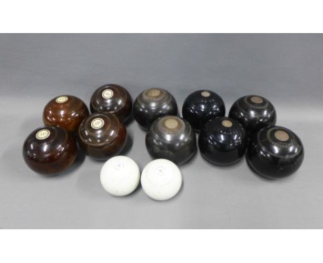 A collection of Victorian and later bowling balls together with two ceramic jacks (12)