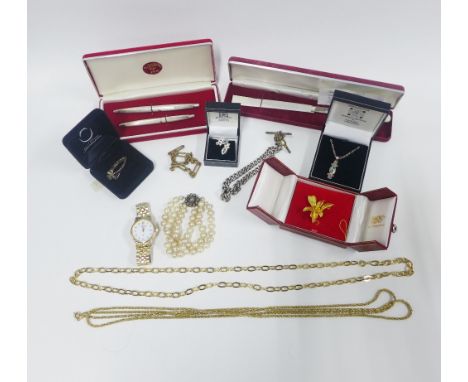 A collection of silver and costume jewellery together with a boxed set containing a silver pen and pencil and a mother of pea