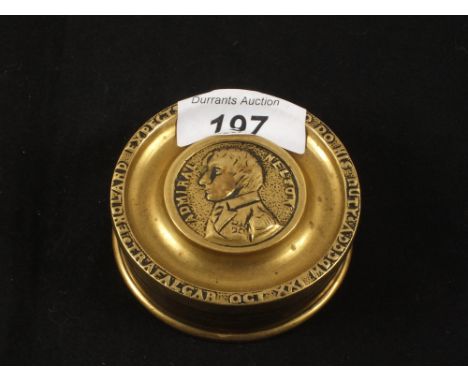 A circular Brass snuff box, the lid with Nelsons portrait