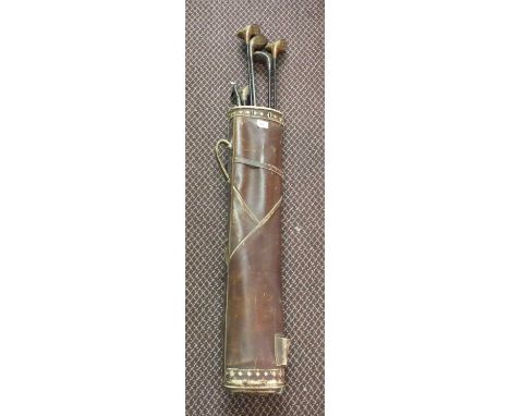 A bag of eight vintage golf clubs
