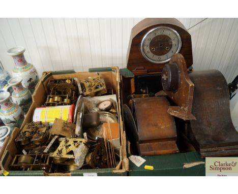 Two boxes of clocks and clock spares