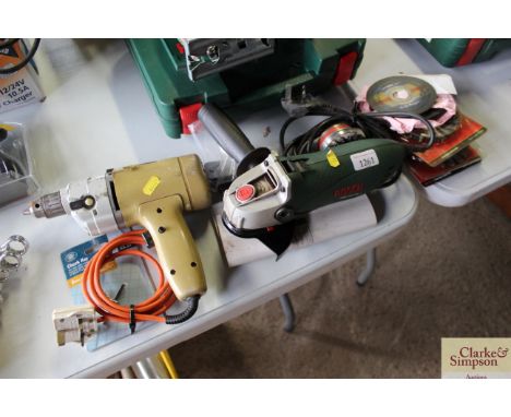 A Black &amp; Decker drill and a Bosch angle grinder and various attachments