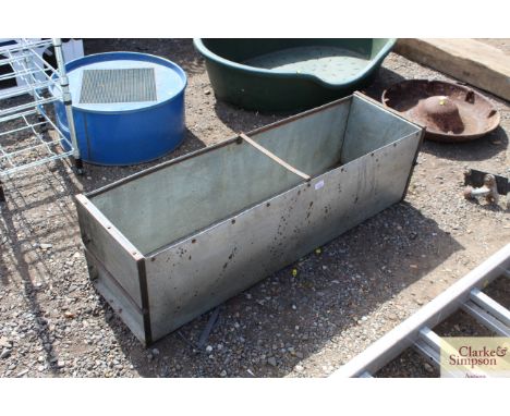 A long galvanised and metal garden planter