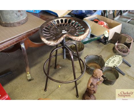 A cast iron adjustable tractor seat stool (95)
