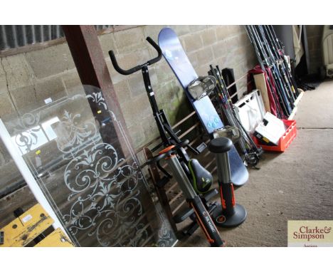 Three pieces of gym equipment including Core Magic, Squat Magic and an Ab booster