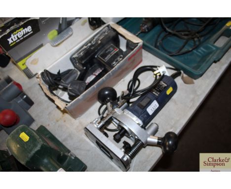 A Ferm router and a Black &amp; Decker orbital sander
