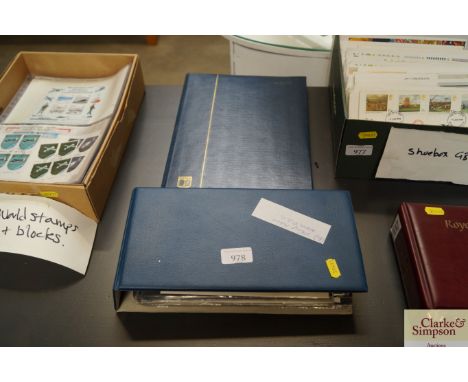 A stamp album and First Day covers album