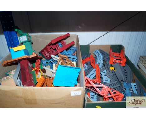 Two boxes containing various Thomas The Tank Engine train track, buildings and accessories