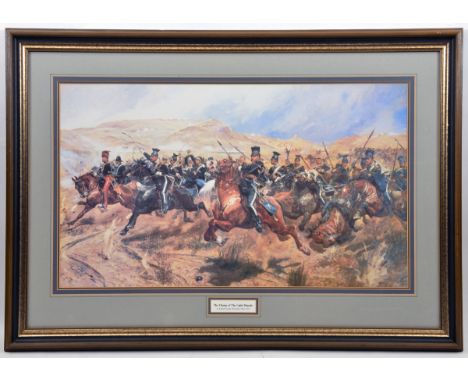 A large coloured print “The Charge of the Light Brigade”, after original by Caton Woodville, well mounted and framed, 27½” x 