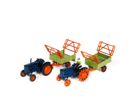 A Britains Ltd Fordson Major Tractor (128F). In dark blue with orange wheels and rubber tyres (driver missing). Together with