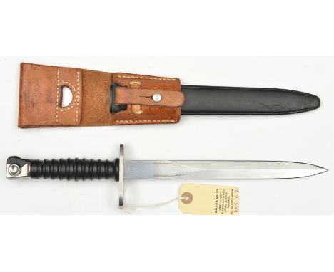 A Swiss SIG Sturmgewehr M57 bayonet,  in sheath with light brown leather frog. Near VGC         