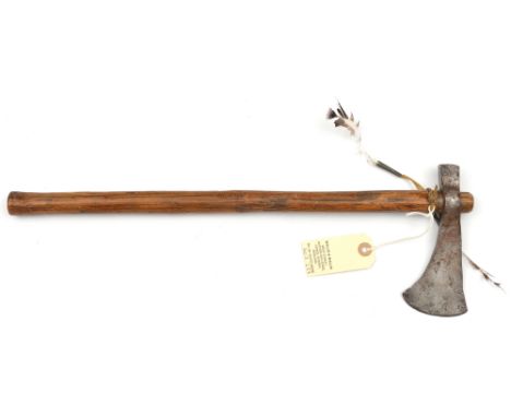 An Indian tomahawk style axe,  simple blade 2½”, plain haft, 18” overall, with feather tassel (worn). GC 