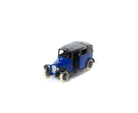 A rare Dinky Toys Taxi (36g). An example in violet blue and black with open rear window, black smooth wheels and white rubber