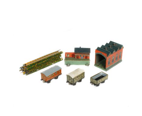 A quantity of Bing Miniature Table Railway. 1920s tinplate OO gauge railway items including; a GWR coach, an LNER coach, guar