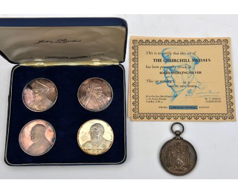 A set of 4 sterling silver medallions, commemorating Sir Winston Churchill, issued by John Pinches as a special American Expr