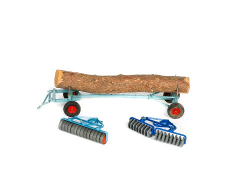 3 Britains Ltd trailers. A timber trailer (129F) in light blue with red wheels and log load. A disc harrow (9534) in blue and